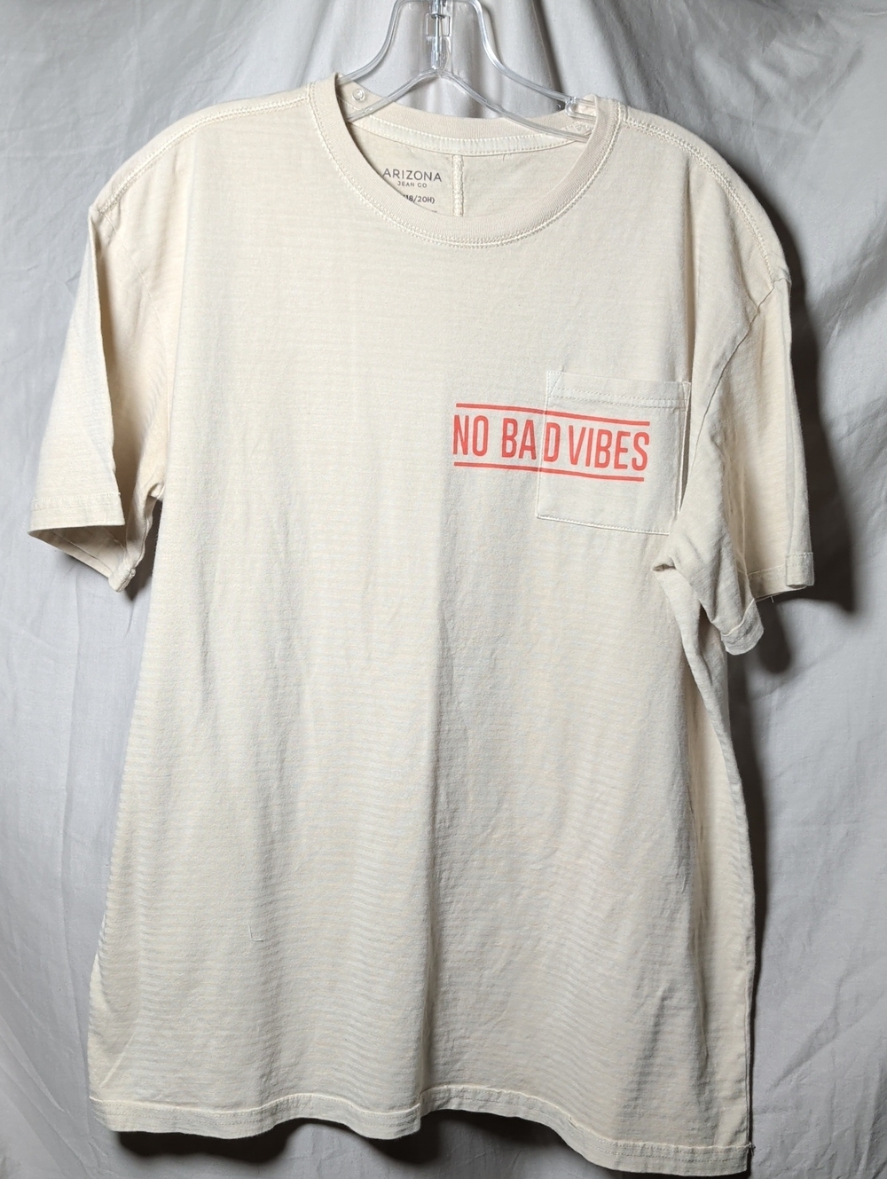 Arizona Jean Company Cream Pocket Tee with Coral 'No Bad Vibes' Print Unisex
